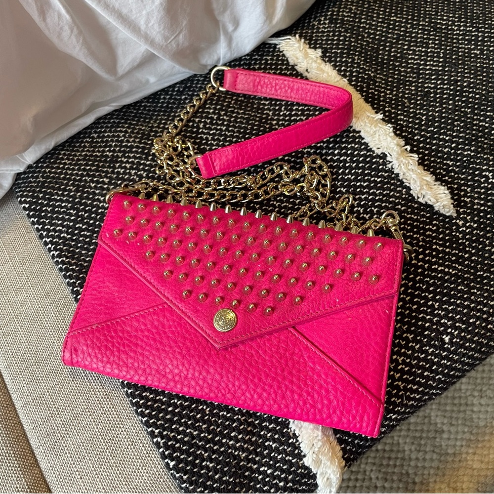 Rebecca Minkoff hot pink crossbody bag with gold studs and hardware